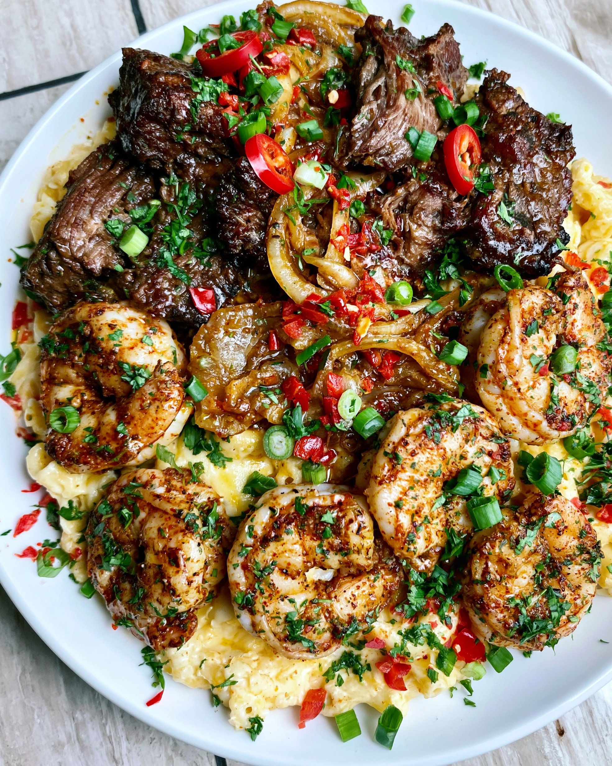Shredded Beef Short Ribs and Cajun Shrimp over Creamy Macaroni and Cheese