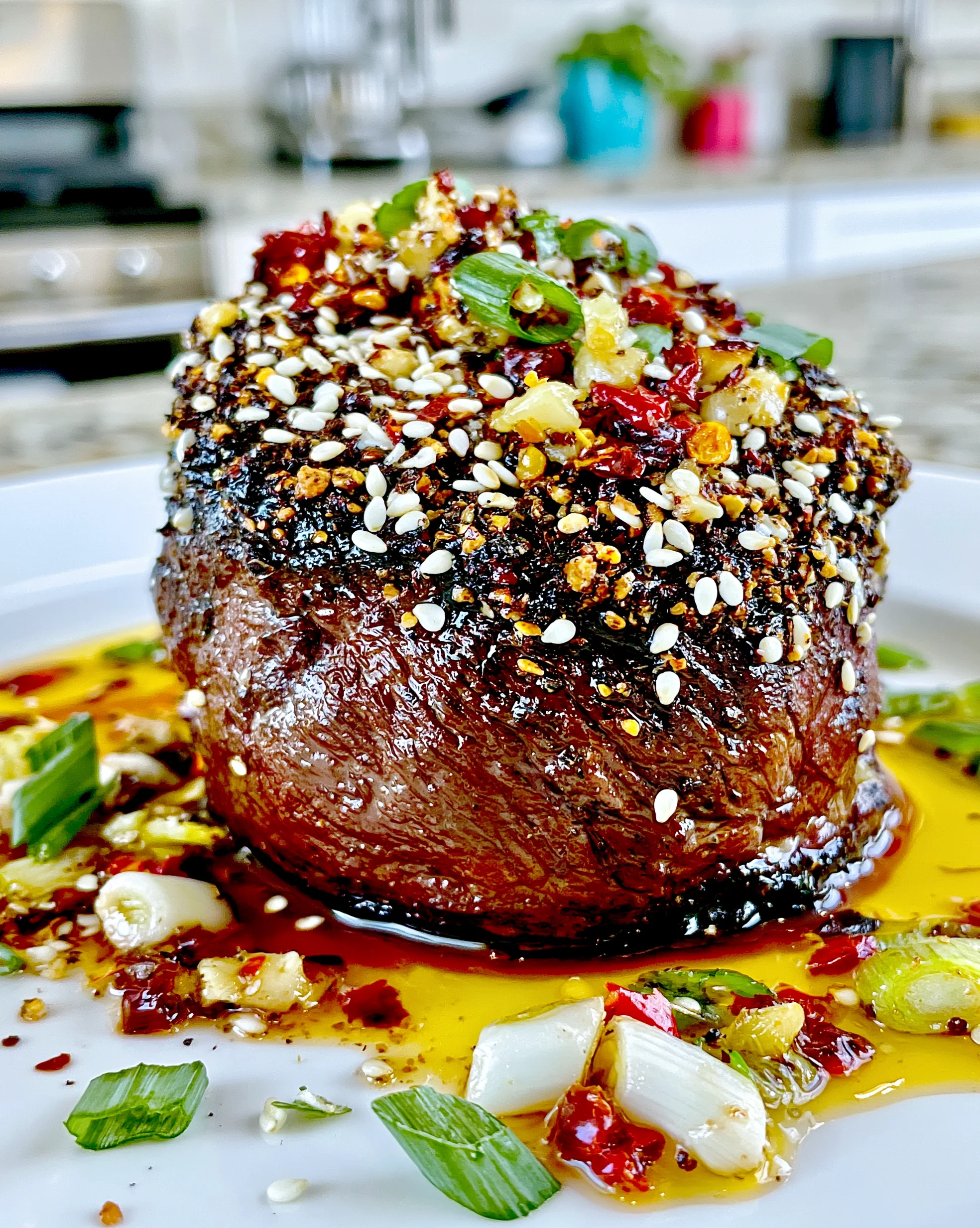 Crushed Szechuan Peppercorn and Toasted White Sesame-Crusted Filet Mignon with a Charred Scallion Ginger Butter