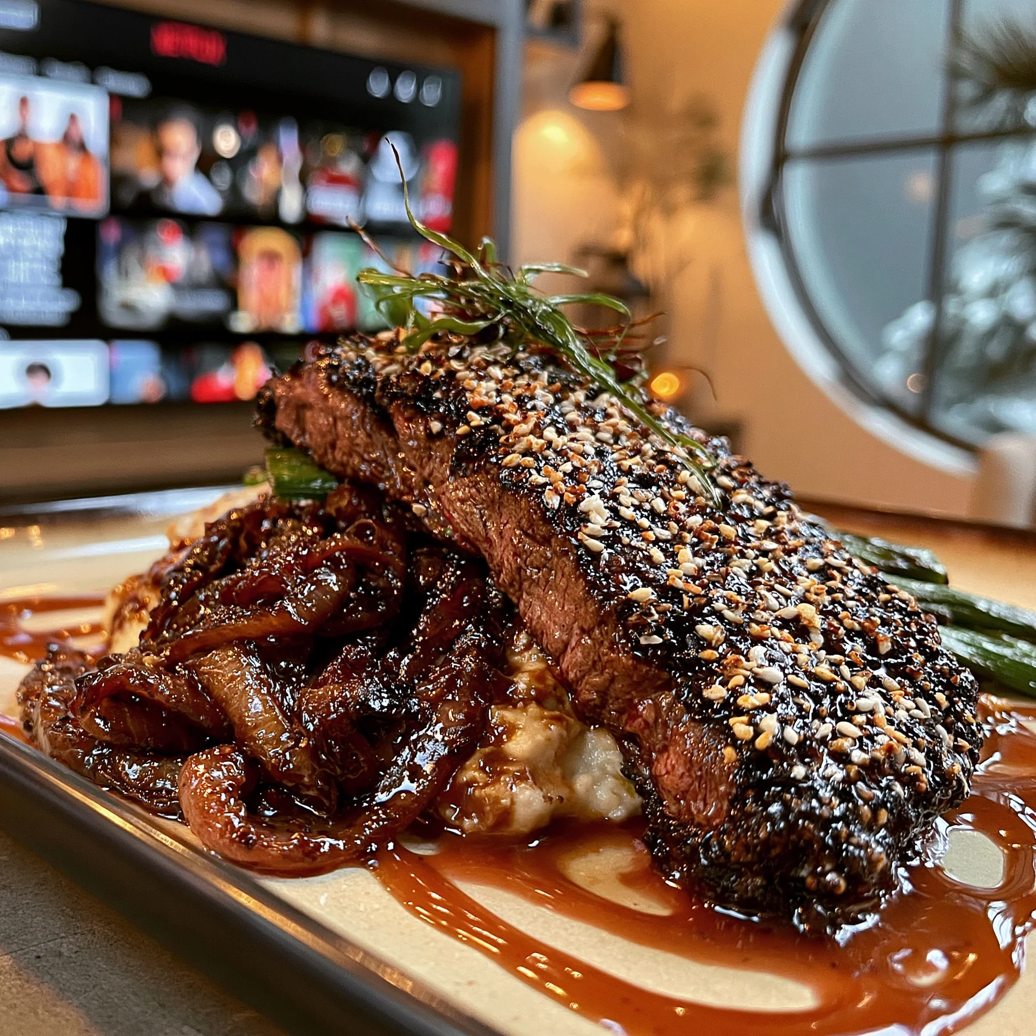 Horseradish-Crusted Hanger Steak with Caramelized Onions & Crispy Leeks