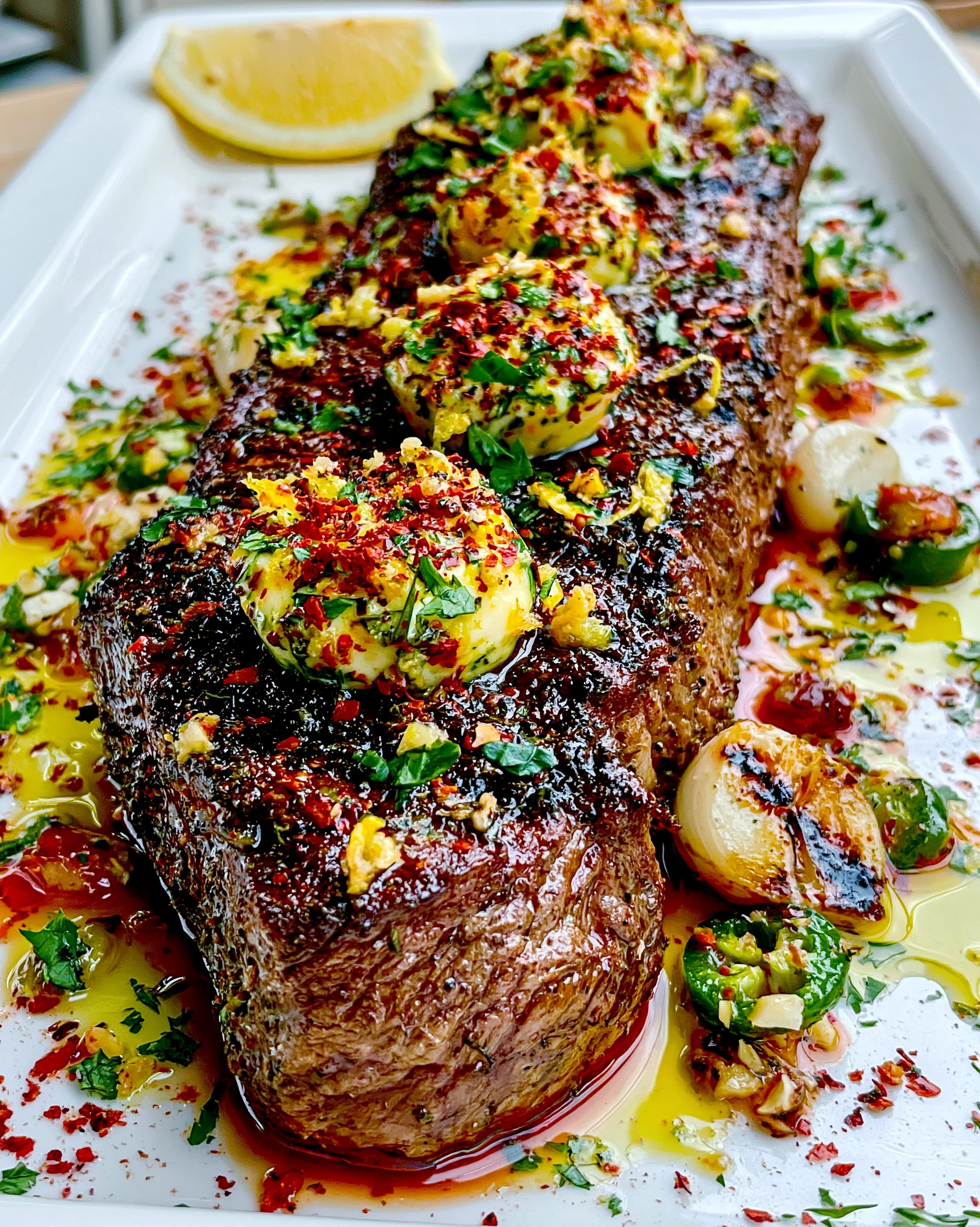 Toasted Sumac and Lemon Zest-Crusted Strip Steak with a Charred Poblano Compound Butter